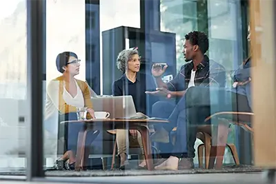 Group of people meeting in conference room