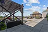 Rooftop Terrace at Six Cord Apartments with Gaming, Pergolas, Lounge Seating, Fire Pit, Cornhole, Grilling Station, and Downtown St. Louis City Views