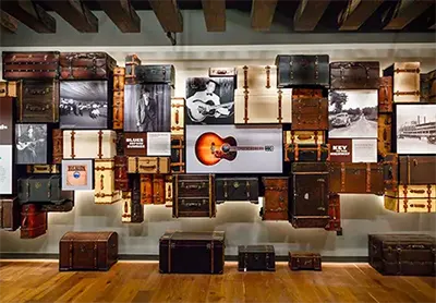 Interior exhibit at the National Blues Museum with guitars, amplofiers, and album art
